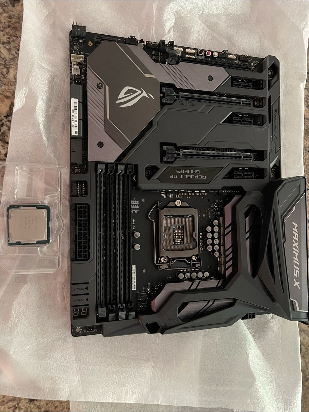 Intel Black and Gray ROG Maximus X Style Motherboard with processor.